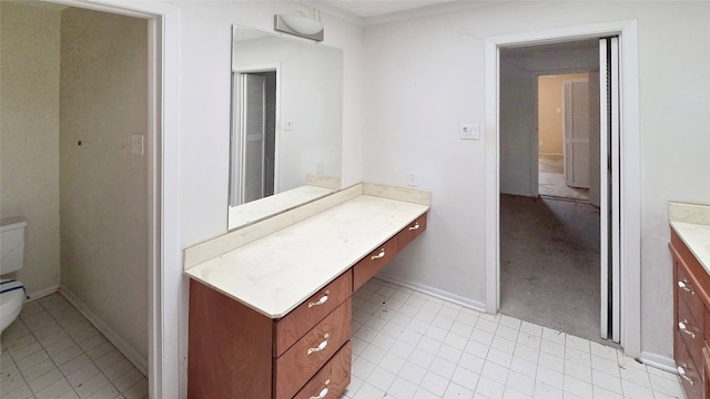 bathroom with baseboards and vanity