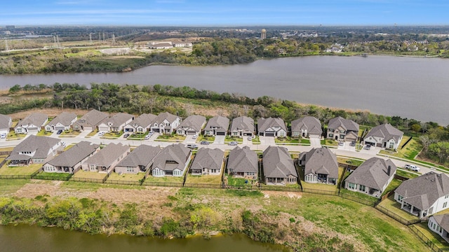 bird's eye view featuring a residential view and a water view