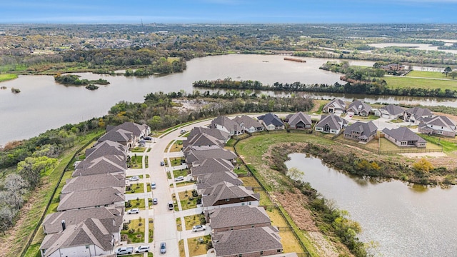 bird's eye view with a residential view and a water view