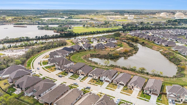 aerial view with a residential view and a water view