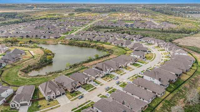 birds eye view of property with a residential view and a water view