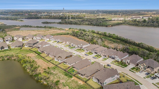 aerial view with a residential view and a water view