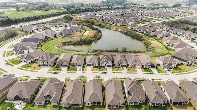 birds eye view of property featuring a residential view and a water view