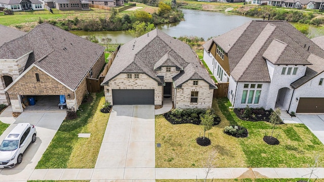 bird's eye view with a residential view and a water view