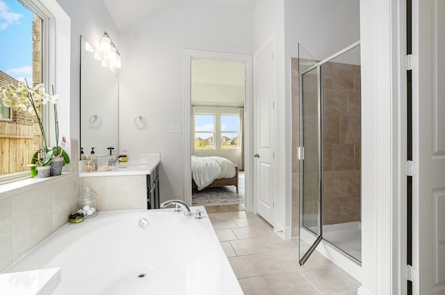 ensuite bathroom with tile patterned floors, a stall shower, ensuite bath, a bath, and vaulted ceiling