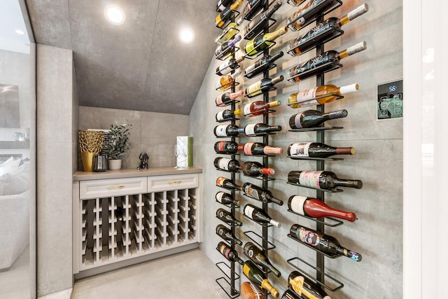 wine room featuring recessed lighting and concrete flooring