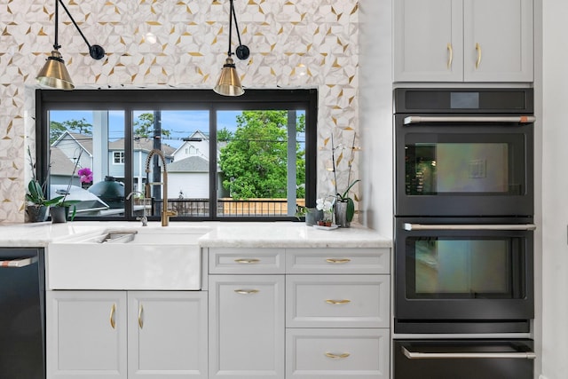 kitchen with white cabinetry, a sink, dobule oven black, dishwasher, and a warming drawer