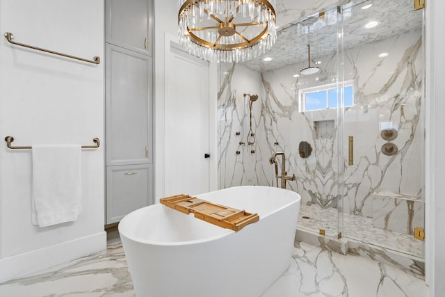 full bath featuring a marble finish shower, a soaking tub, marble finish floor, and an inviting chandelier