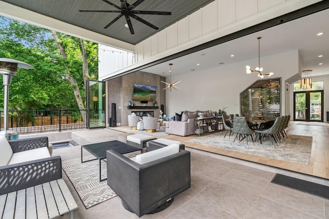 view of patio / terrace with ceiling fan, fence, an outdoor hangout area, french doors, and outdoor dining area