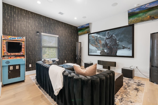 home theater with recessed lighting, wood finished floors, and visible vents