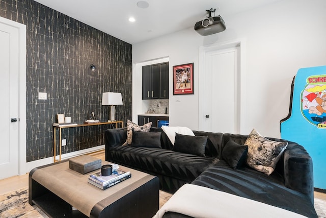 living area featuring recessed lighting and tile walls