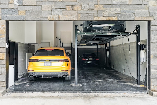 garage with concrete block wall