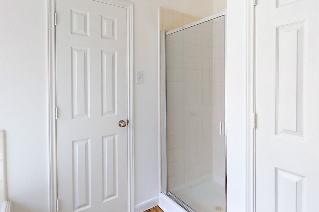 full bathroom featuring a stall shower