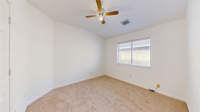 unfurnished room with lofted ceiling, baseboards, visible vents, ceiling fan, and carpet