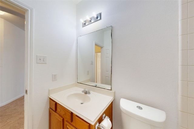 bathroom with toilet and vanity