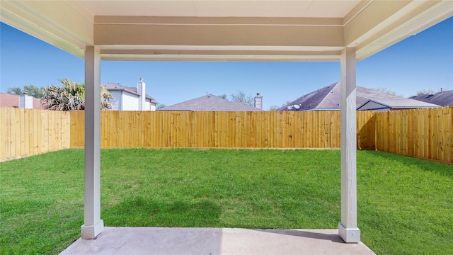 view of yard with a fenced backyard