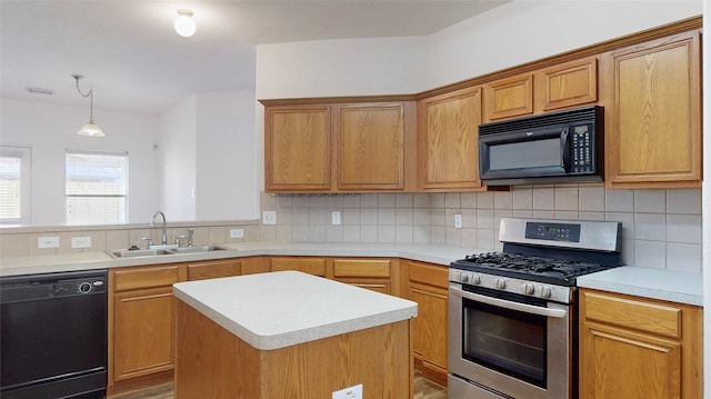 kitchen with a sink, light countertops, black appliances, and backsplash
