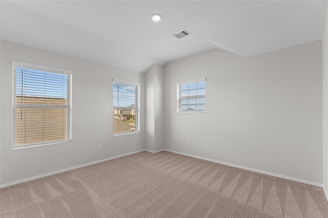 carpeted spare room with recessed lighting, baseboards, lofted ceiling, and visible vents