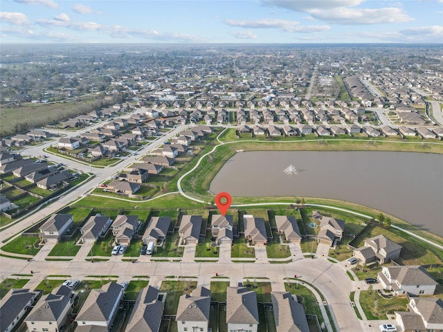 bird's eye view with a residential view and a water view