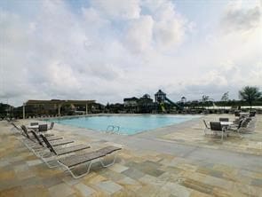 community pool with a patio