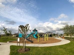 community playground featuring a lawn