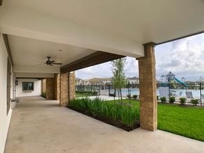 view of patio featuring fence and ceiling fan