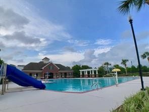 community pool with a water slide