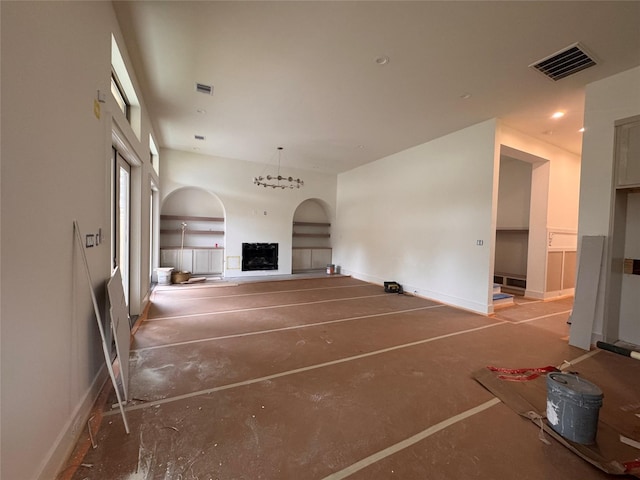 710 E 18th St, Houston, TX 77008 - unfurnished living room featuring baseboards, a fireplace, and arched walkways