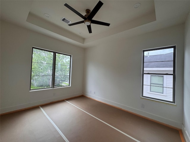 710 E 18th St, Houston, TX 77008 - unfurnished room featuring a ceiling fan, a tray ceiling, and baseboards