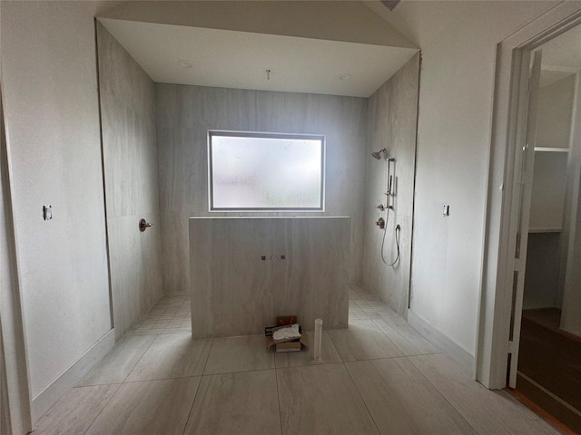 710 E 18th St, Houston, TX 77008 - bathroom featuring a walk in shower and baseboards