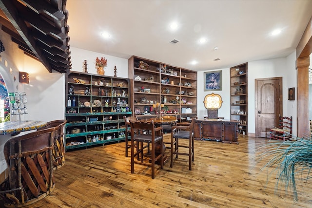 interior space featuring wood-type flooring, visible vents, and recessed lighting