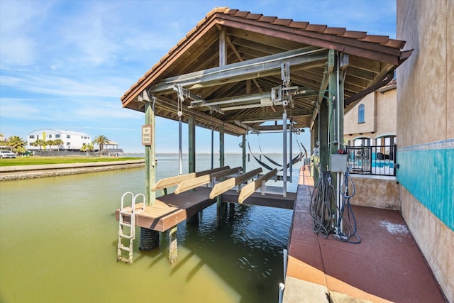 view of dock with a water view and boat lift