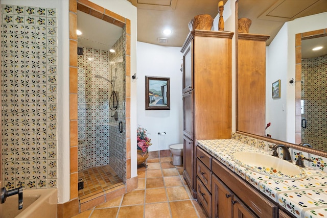 bathroom featuring a tub to relax in, vanity, tile patterned flooring, toilet, and a stall shower