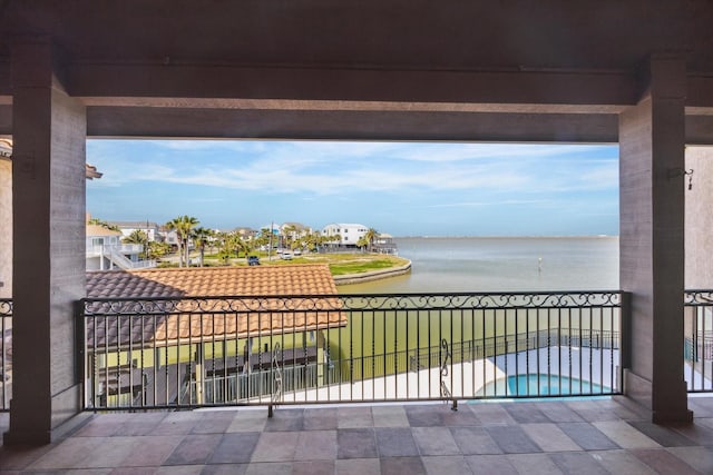 balcony featuring a water view