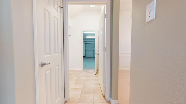 corridor with light tile patterned floors