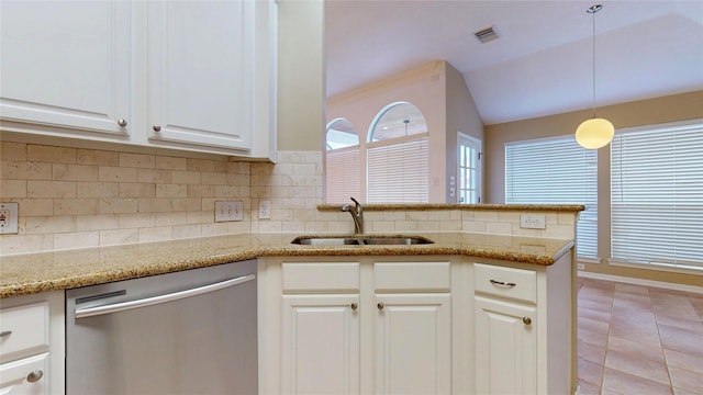 kitchen with a sink, visible vents, tasteful backsplash, and stainless steel dishwasher