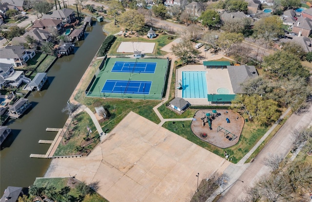 drone / aerial view with a water view and a residential view