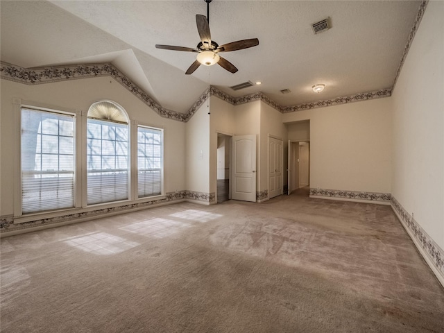 2402 Duhon Pl, Seabrook, TX 77586 - unfurnished bedroom with carpet floors, baseboards, lofted ceiling, ceiling fan, and a textured ceiling