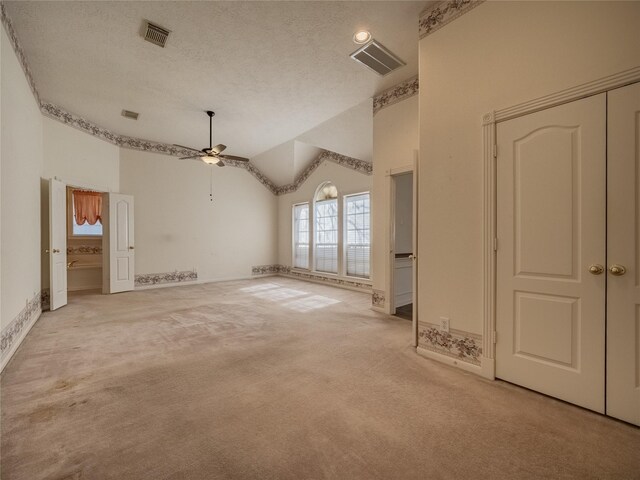 additional living space with visible vents, a ceiling fan, baseboards, and carpet flooring