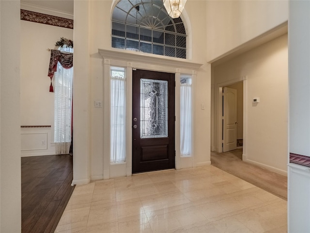 2402 Duhon Pl, Seabrook, TX 77586 - entryway with a high ceiling, ornamental molding, and baseboards