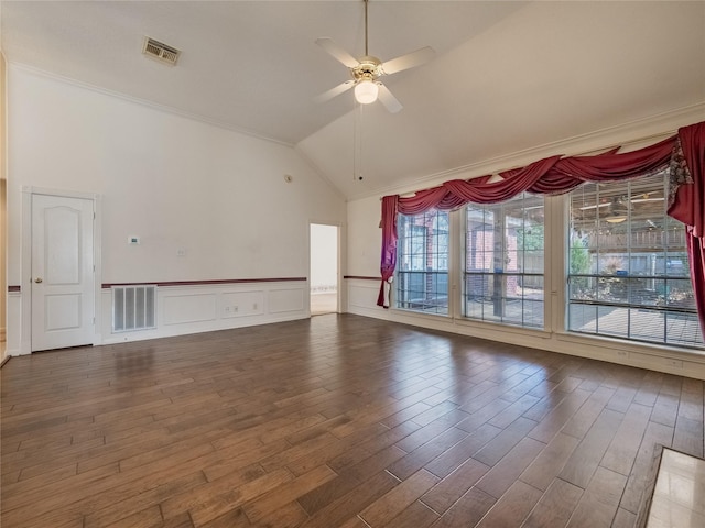 spare room with high vaulted ceiling, a ceiling fan, wood finished floors, and visible vents