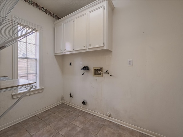 2402 Duhon Pl, Seabrook, TX 77586 - laundry room featuring gas dryer hookup, hookup for an electric dryer, washer hookup, cabinet space, and baseboards
