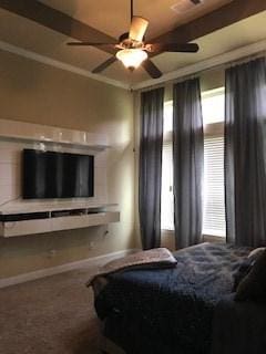 bedroom with a ceiling fan, carpet floors, and baseboards