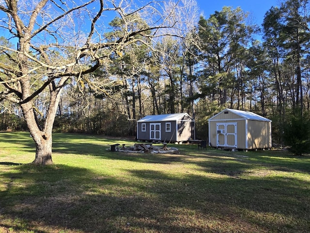 view of yard featuring a storage shed and an outdoor structure