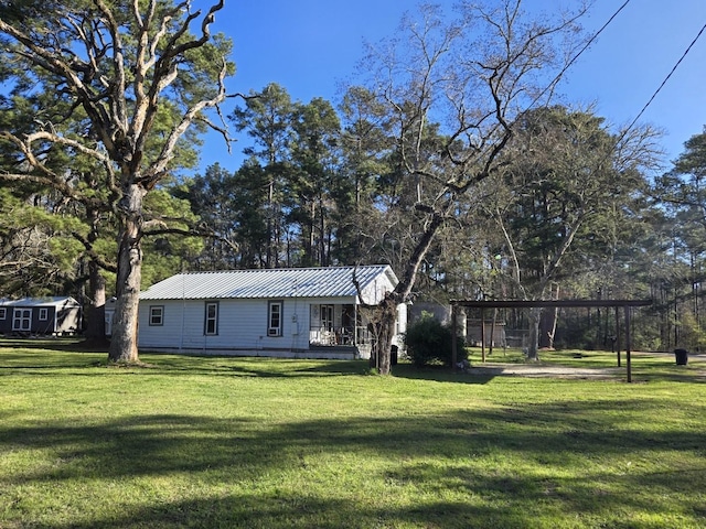 view of yard featuring covered porch