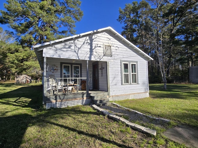 bungalow-style house with a porch and a front yard