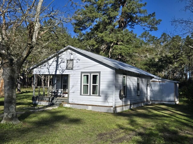 exterior space featuring a porch and a front lawn