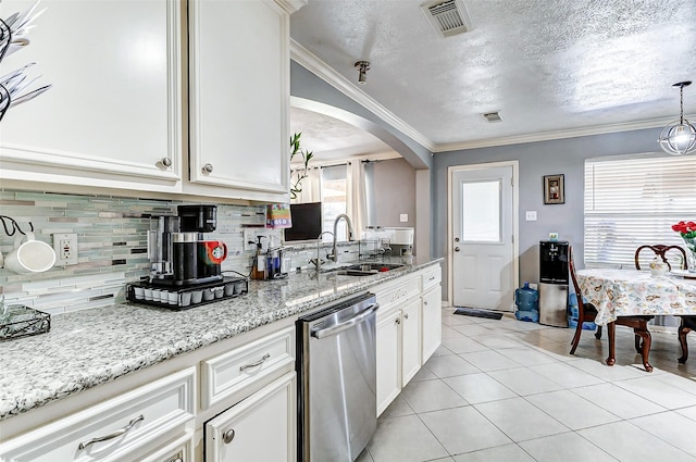 kitchen with visible vents, arched walkways, stainless steel dishwasher, light tile patterned flooring, and a sink