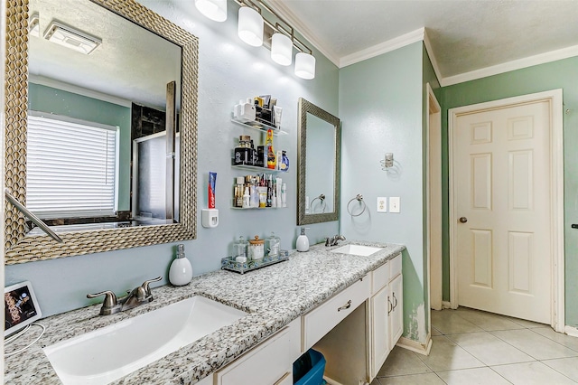 full bath featuring tile patterned floors, visible vents, ornamental molding, and a sink