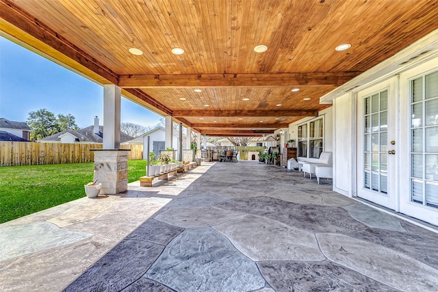 view of patio / terrace featuring french doors and fence